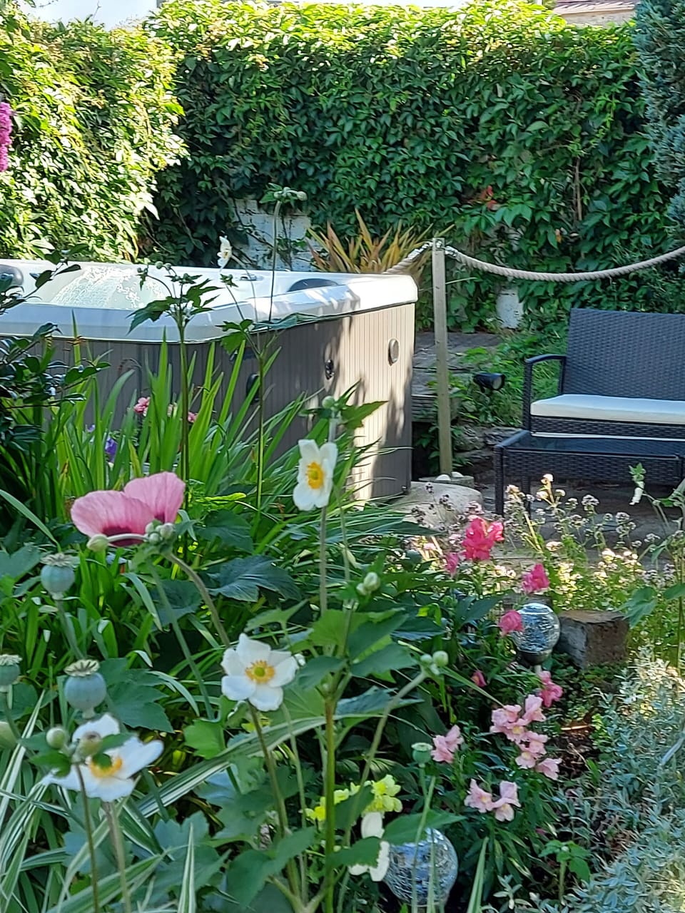 Relax in the private Hot Tub in the flower filled walled garden