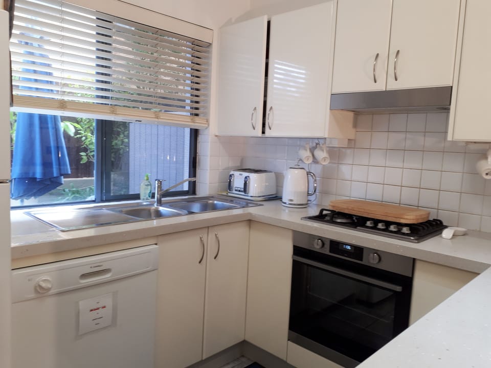 Kitchen with Window to Rear Terrace.