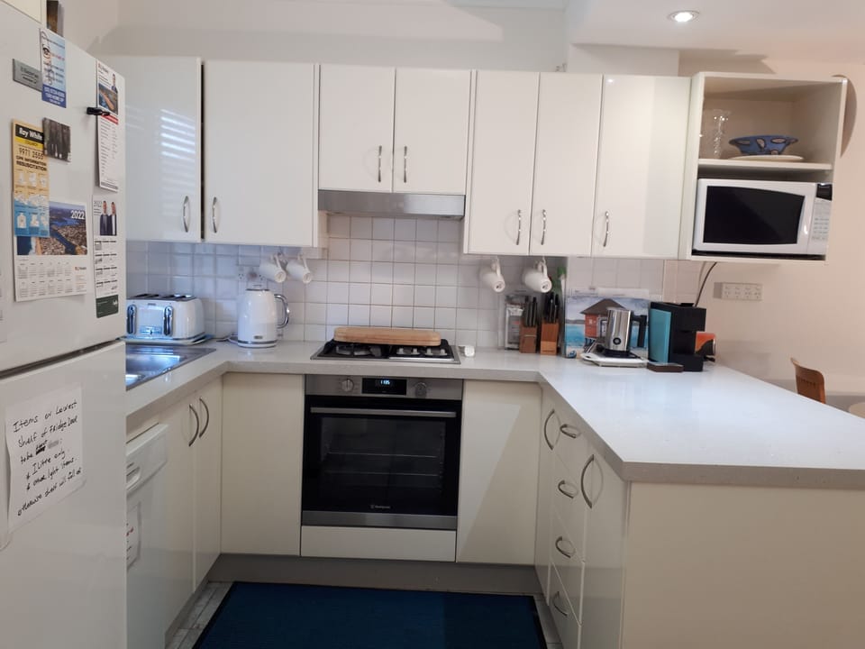Fully equipped Kitchen with White Goods, China, Cutlery, Coffee maker.