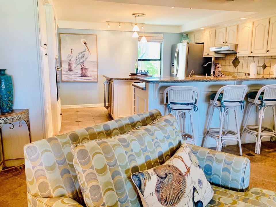 View of kitchen from sofas.