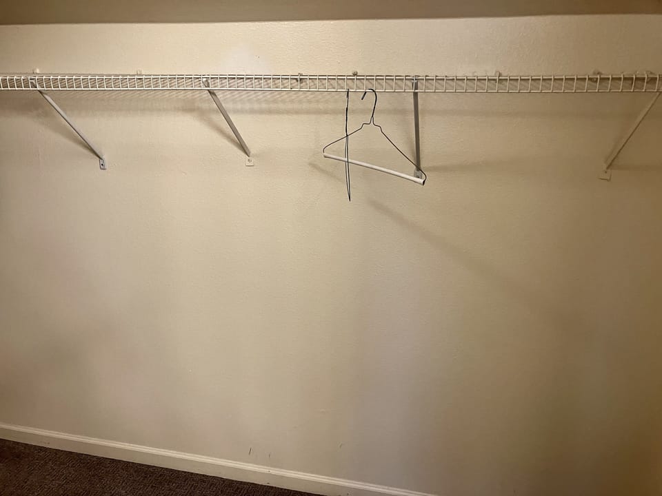 This large walk in closet in the master has room for everything