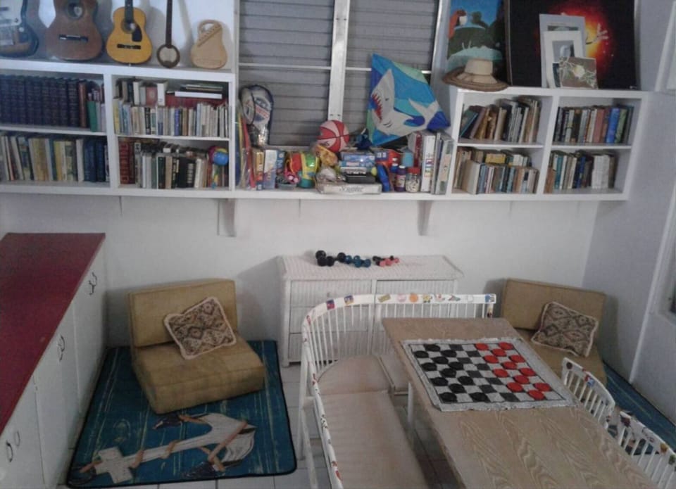 Library/washroom/den with 2 fold-out beds, games, toys, beach gear, etc.
