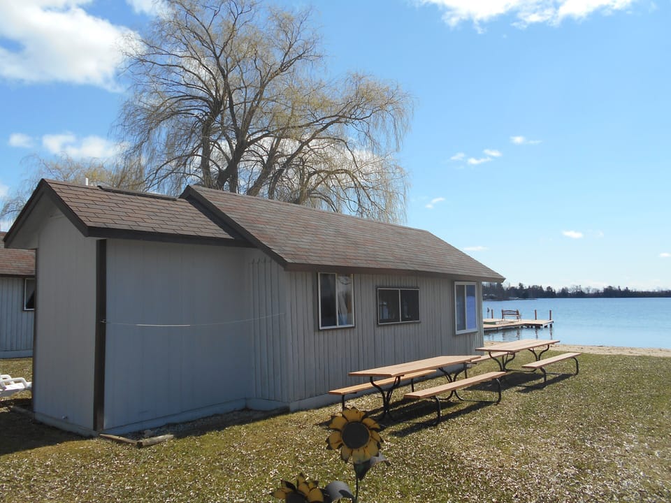 Lake George Resort cabin #2 side view showing lake and swim dock

