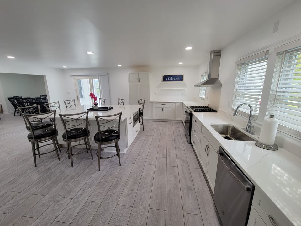 New Kitchen with large island and 9 stools