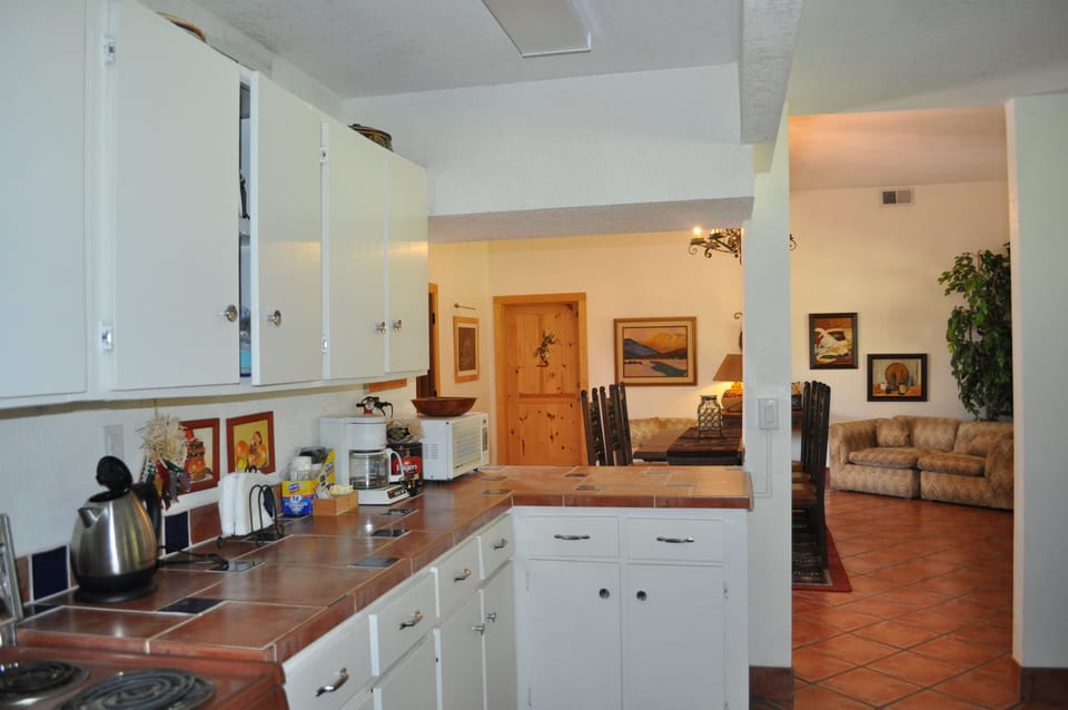Full kitchen opens up to common area