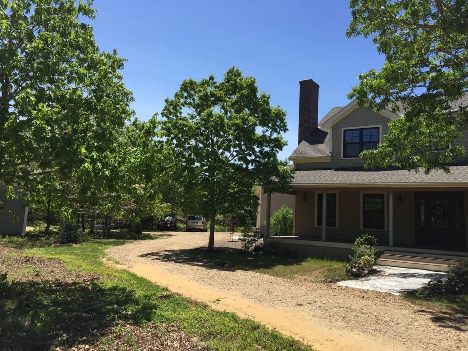 long wrap around driveway with plenty of parking
