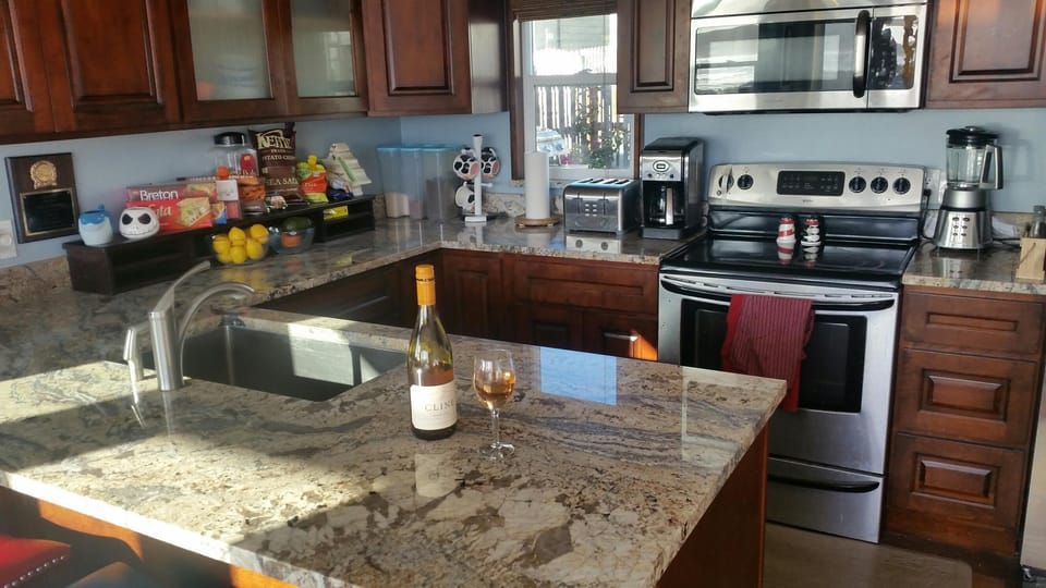 Microwave, Dishwasher, blender, coffee maker and waffle maker.