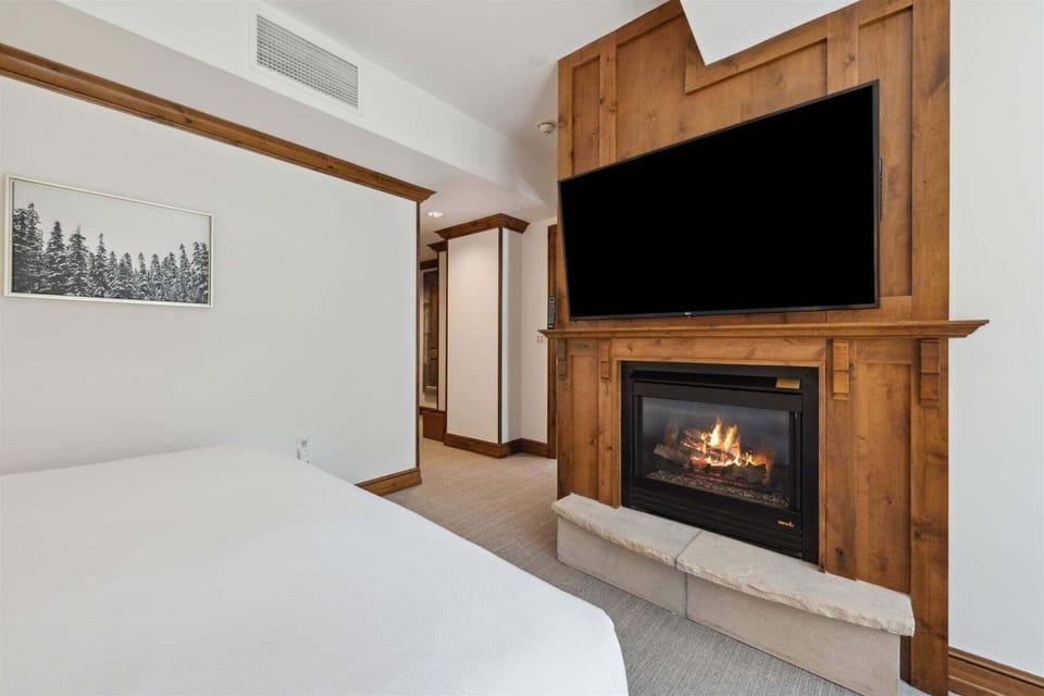 Second bedroom features attached bathroom and fireplace