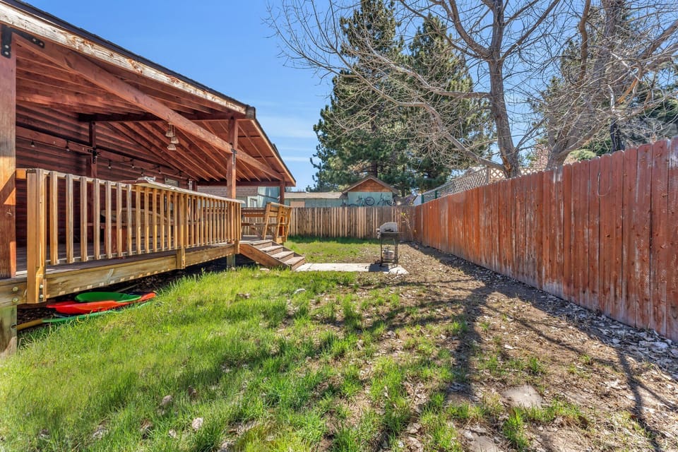 Backyard featuring a deck and BBQ grill