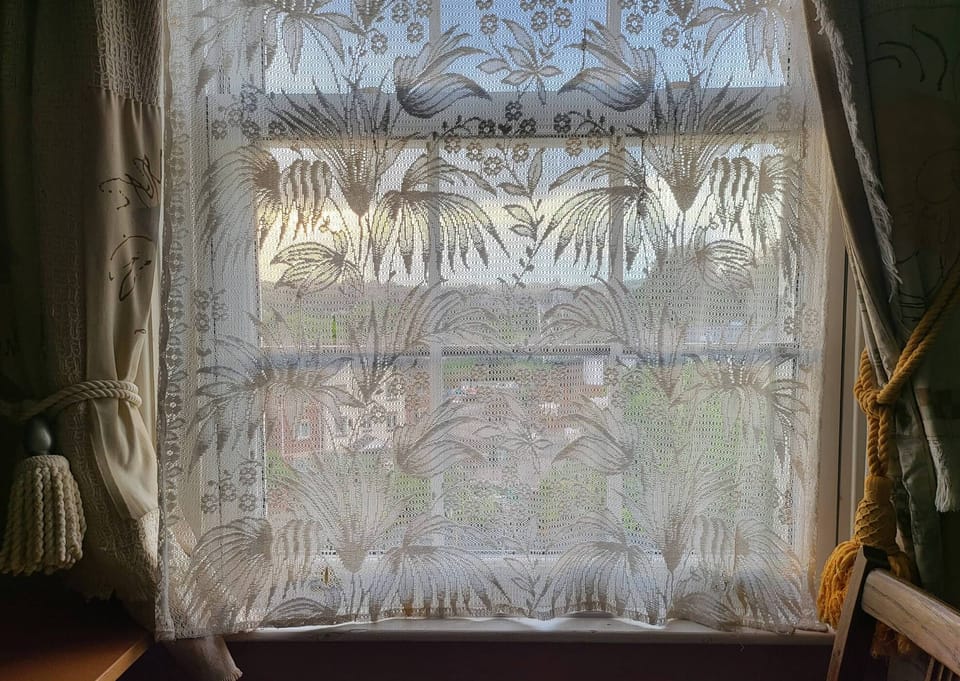 Window with privacy lace curtain