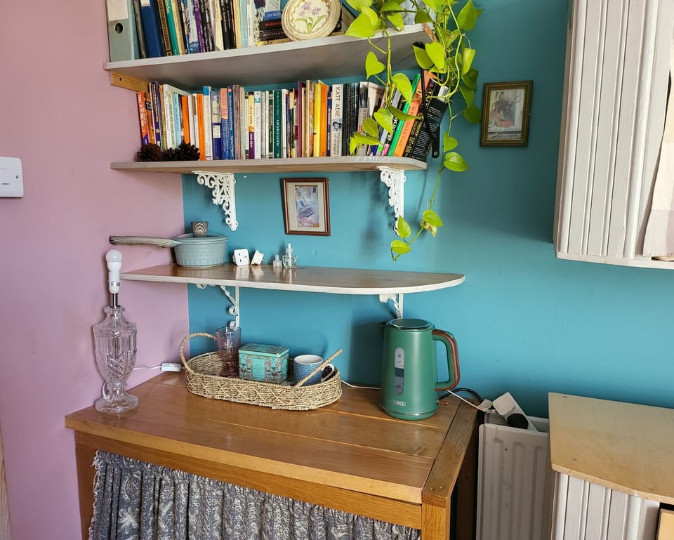 Tea making corner, with suit case storage area underneath.
