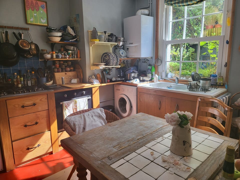 Communal kitchen with gas hob and electric grill.