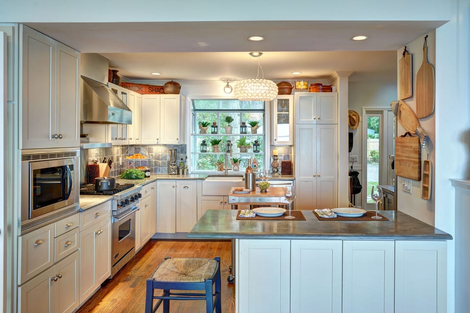 Chef's kitchen w/ Viking gas stove, farmhouse sink, and Sub-zero refrigerator