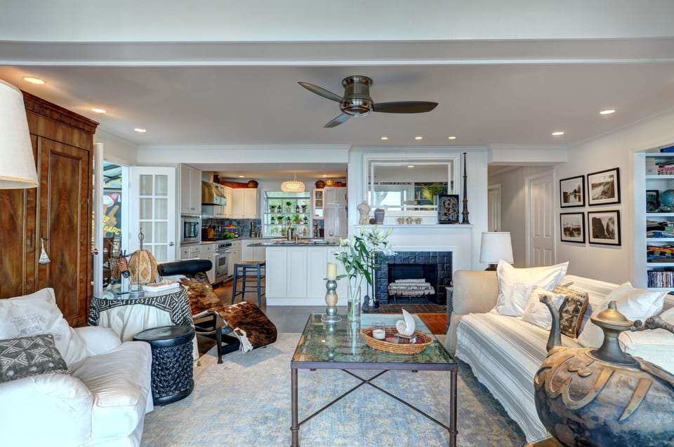 Open plan with eat-in kitchen and wood burning fireplace