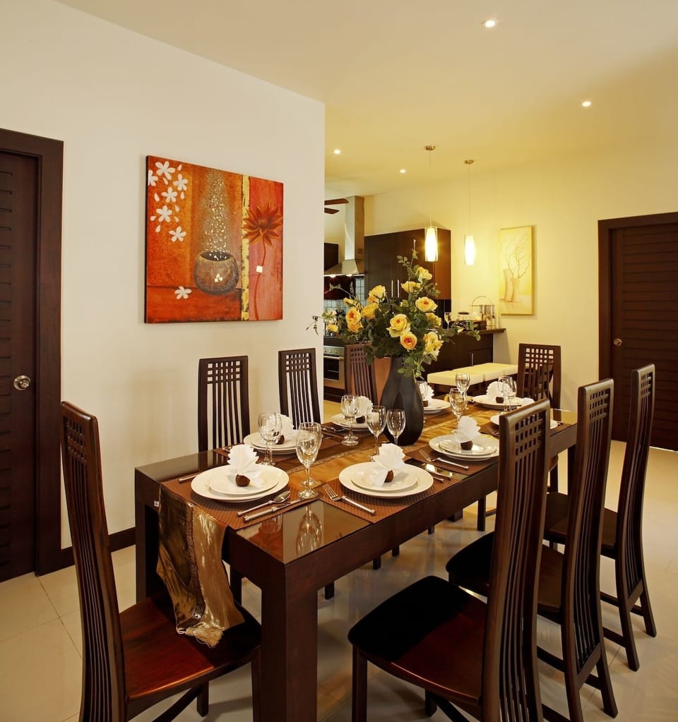 Teak dining table for 8 guests to enjoy delicious in-house prepared Thai cuisine