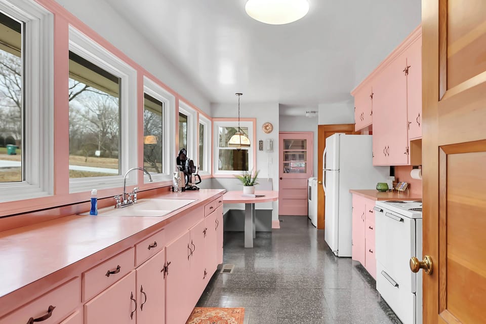 The kitchen still has the original 1955 cabinets, countertops and flooring. 