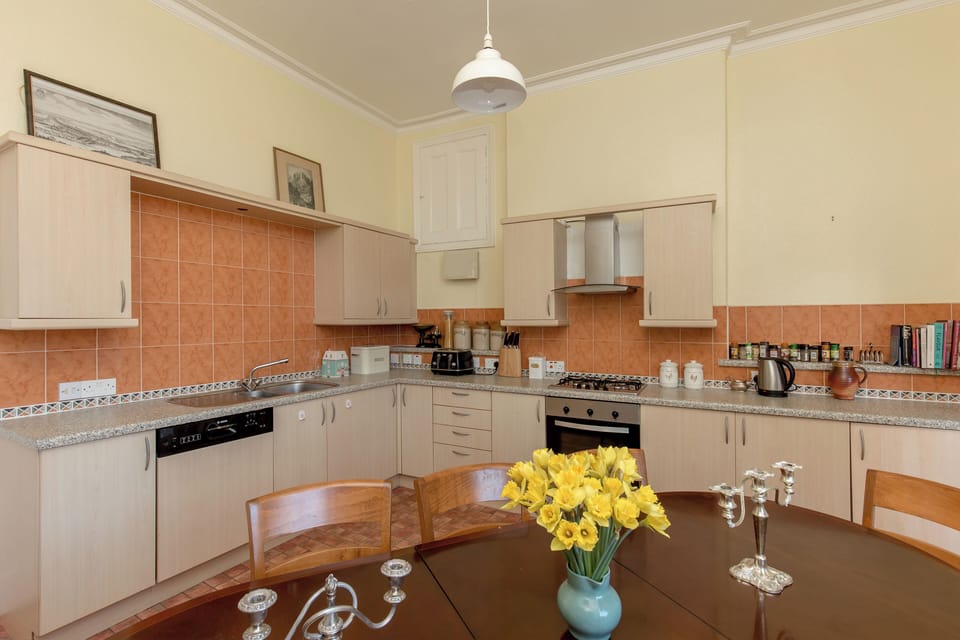 There is a spacious kitchen preparation area
