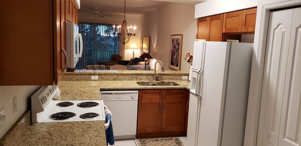 Kitchen remodel in 2019 features new maple finish cabinetry, marble countertops
