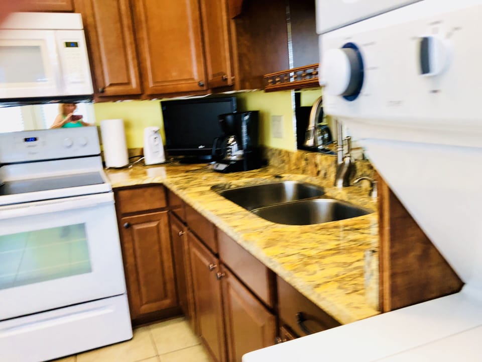 View of sink, granite counter