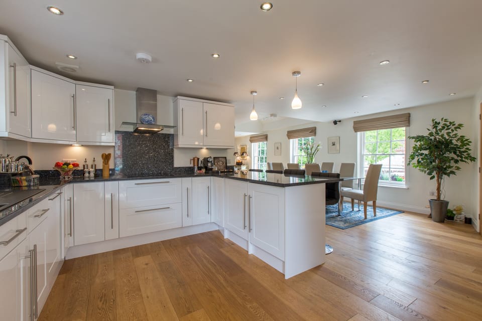 Modern kitchen w/recessed cei and under-counter lighting and granite countertops