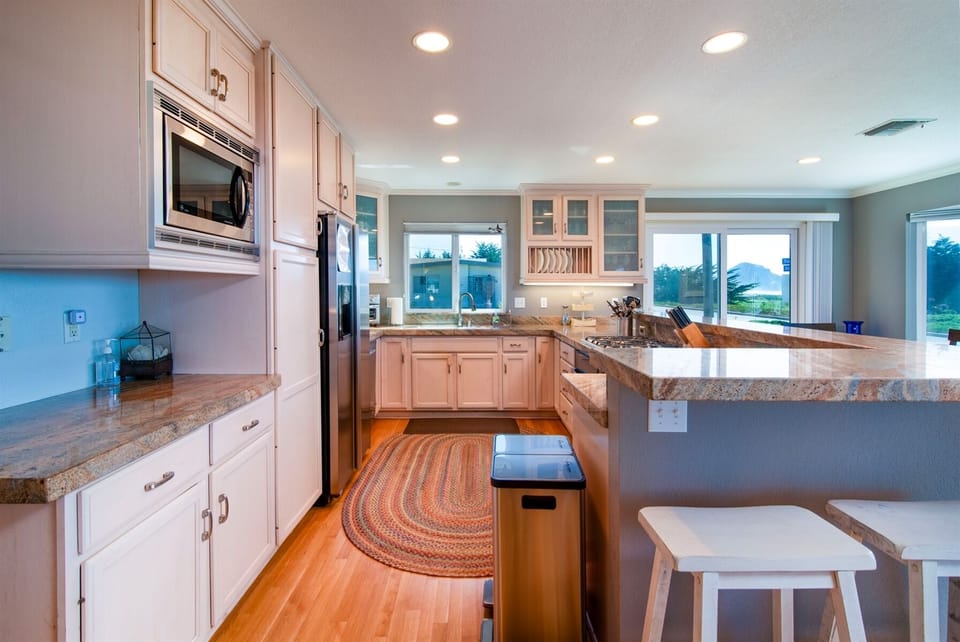 The kitchen with counter seating and well equipped for your cooking needs