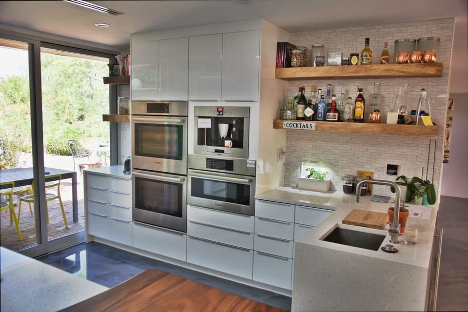 Kitchen high-end appliances include a built-in steamed coffee maker and 3 ovens