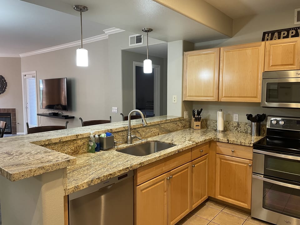 Kitchen with granite countertops and stainless steel appliances