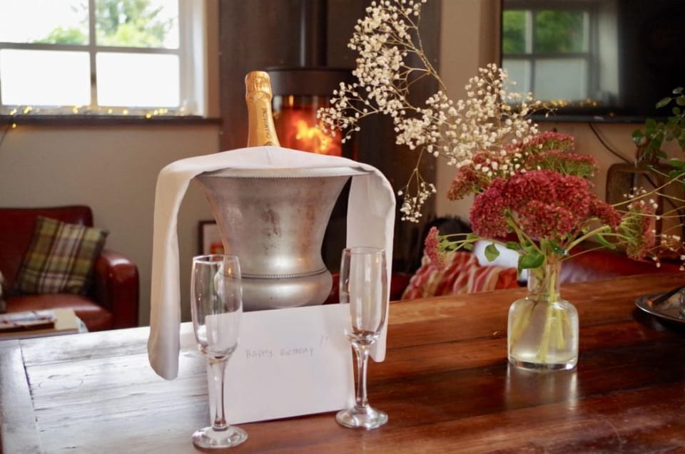 Arrive to a bottle of chilled champagne on ice and a personalised not of your choice for your loved one