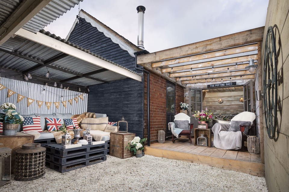 The private garden of The Old Parlour Barn with under cover seating and dining area