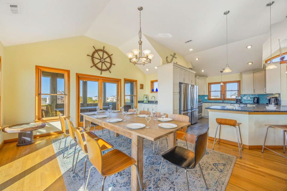 Gather around this spacious dining table where your group can share memorable meals in an open kitchen perfect for culinary adventures.
