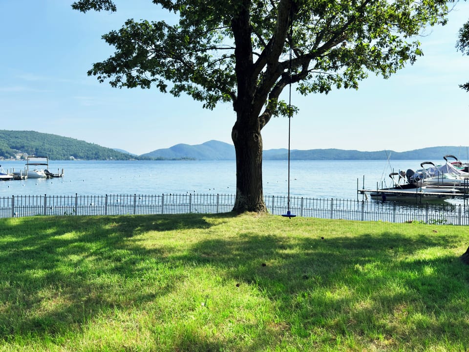 View towards tree swing and beach area flanked by the two docks.
