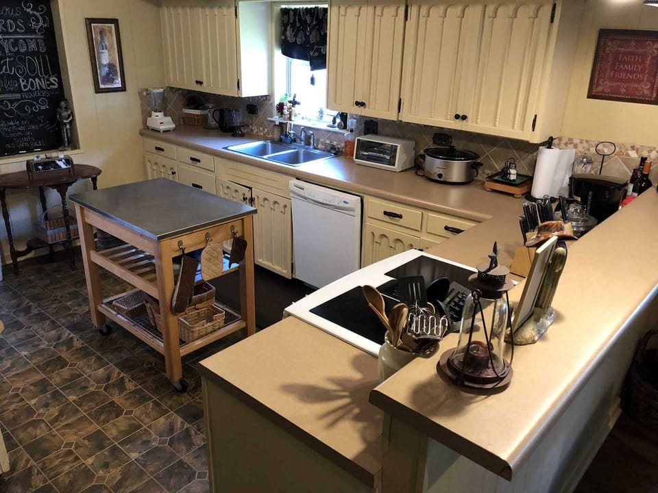 The big country kitchen is stocked with all the appliances and utensils your crew will need for a delicious home-cooked meal!