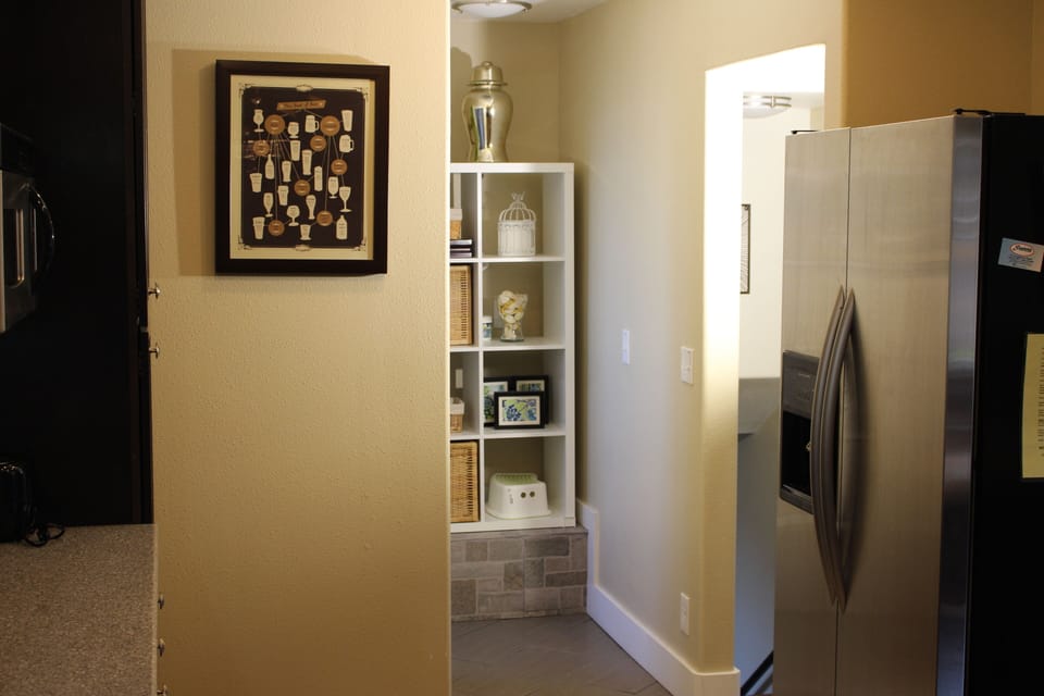 Main level, there's a full bath next to the shelving