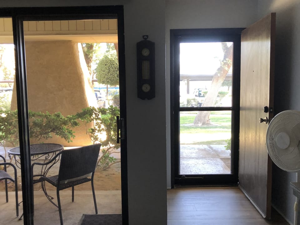 Looking out from living room. Patio very nice, storm door with top half slide.