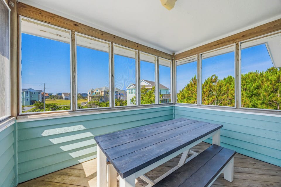 Your screened porch features sweeping coastal views, a picnic-style table, and refreshing sea breezes—perfect for morning coffee or sunset gatherings with loved ones.