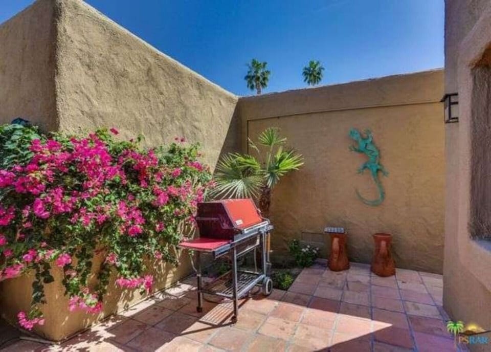 More open private space with a natural gas fed Weber grill.