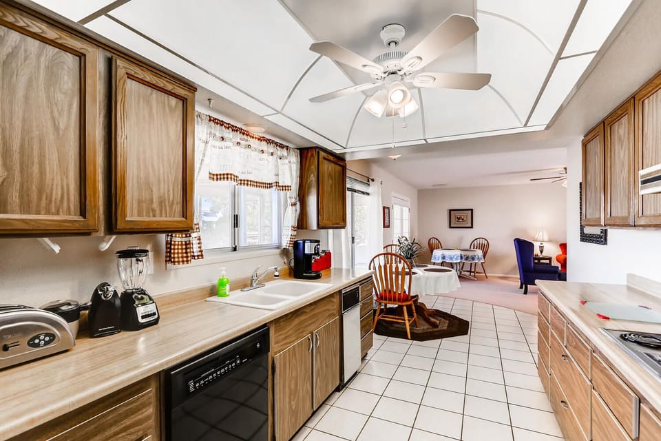 Kitchen Window over double bowl sink, blender, coffee maker, toaster, cannisters