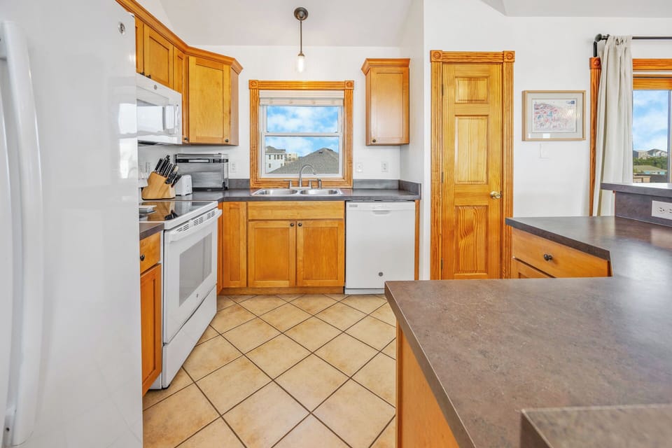 Planning and creating meals are a breeze in the thoughtfully arranged kitchen.