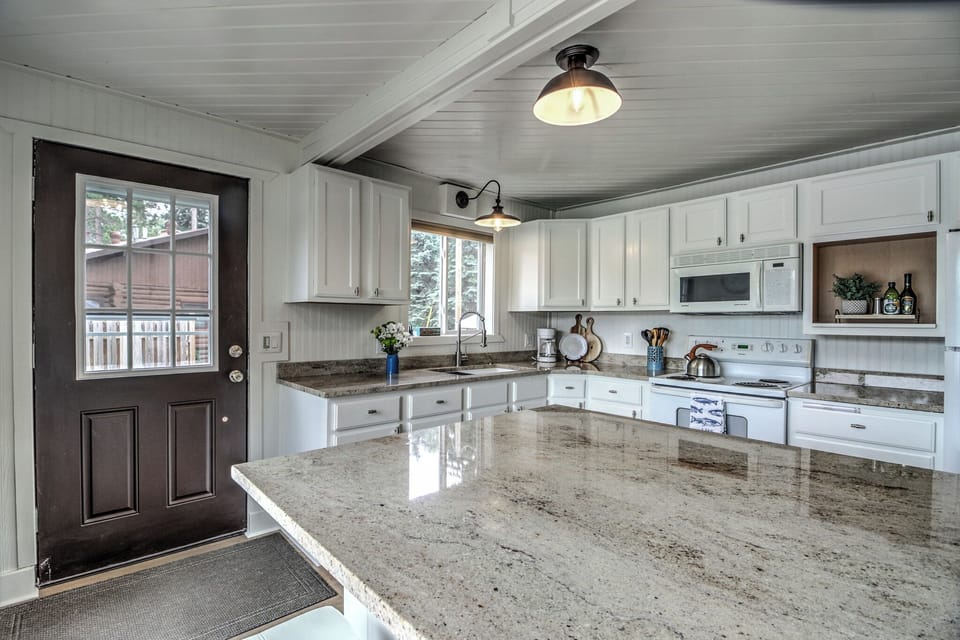 Updated kitchen with dishwasher, gas stove, microwave, and garbage disposal