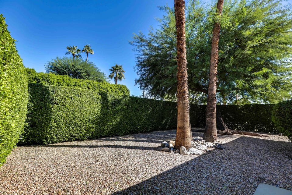 Private front hedged courtyard in front of kitchen and Northeast Master Suite