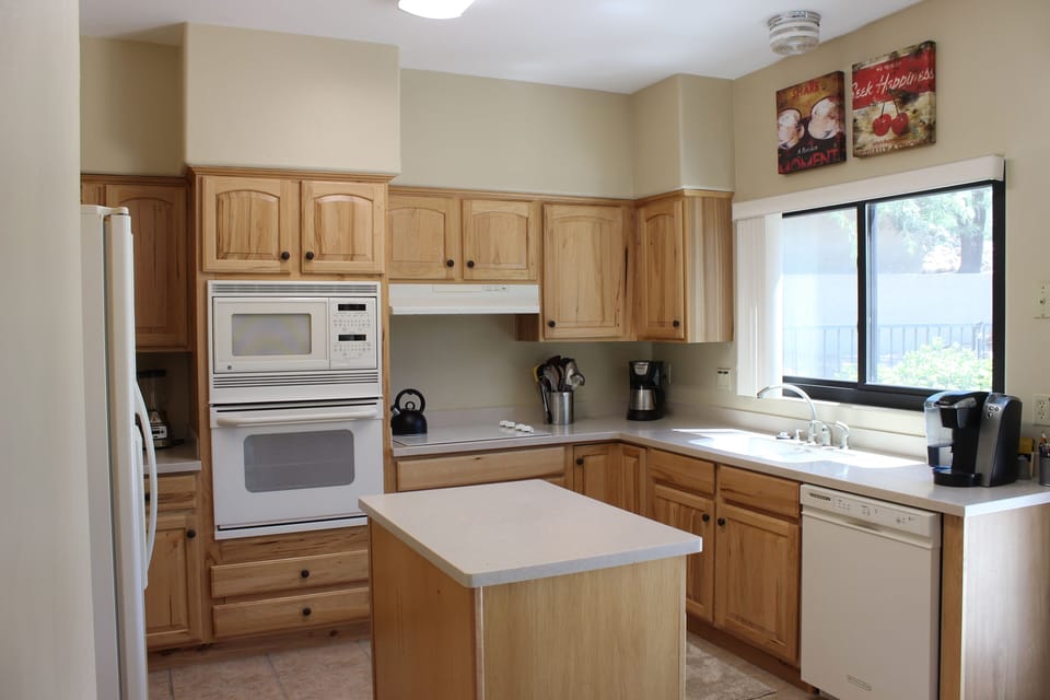 Fully furnished kitchen with extensive quality cookware.  Backyard Patio access.