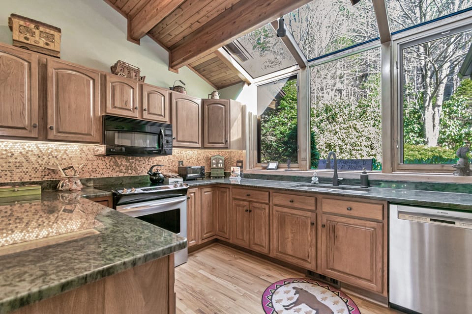 Kitchen with Stainless Steel appliances, and unique US copper penny backsplash