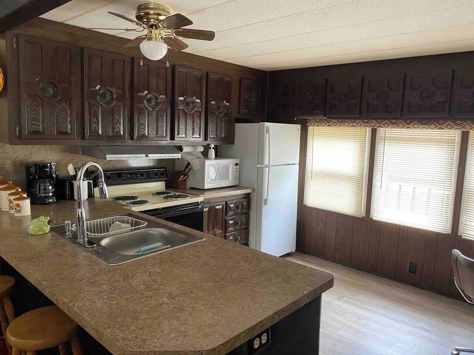 Full modern kitchen for you convenience Stocked with all the kitchen ware you will need Open to the living room for nice family conversation 