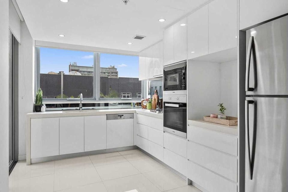 Kitchen with modern Miele appliances and gas cook top