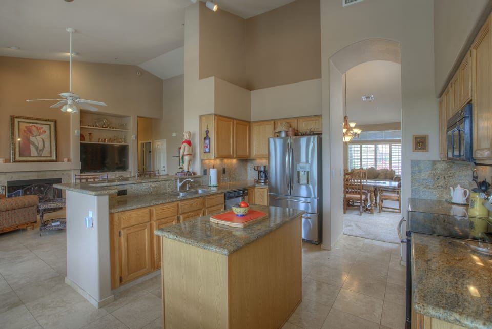 Island kitchen with open, flowing floorplan is perfect for entertaining!