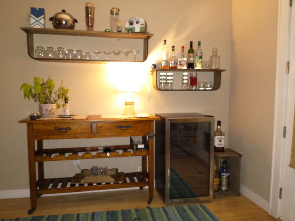 Bar area with fridge, glassware and utensles. 
BYOB 😉