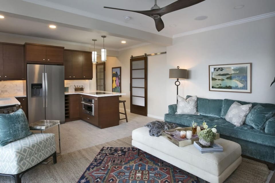 The lower suite`s private living room and full kitchen with AC.