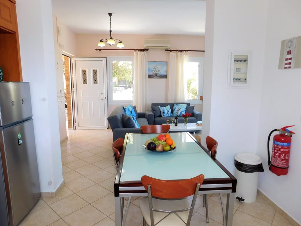 Villa Maria L-shaped kitchen and living room.