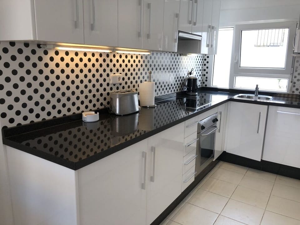 The kitchen with dishwasher, oven, hob microwave, fridge & freezer