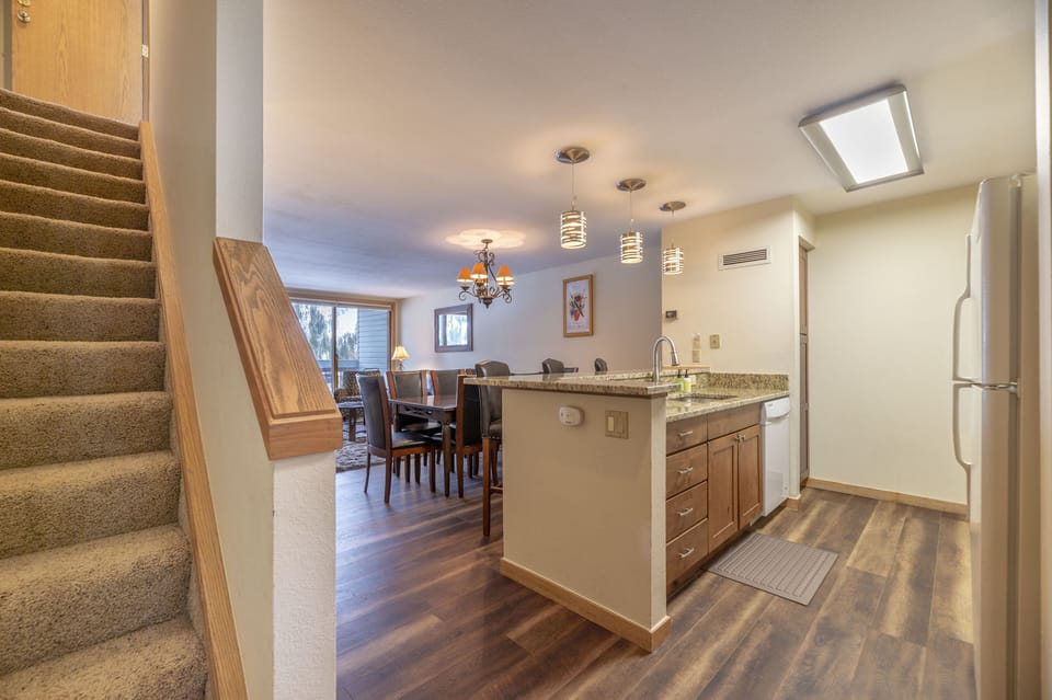 Guests enter the unit on the 1st level (3rd floor). Stairs to 2nd level on left.